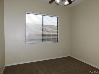 Home is located on a large lot. New interior paint, ceiling fans on Laughlin Ranch Golf Club in Arizona - for sale on GolfHomes.com, golf home, golf lot