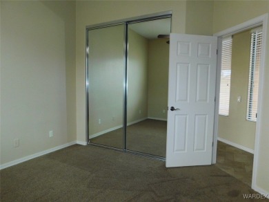 Home is located on a large lot. New interior paint, ceiling fans on Laughlin Ranch Golf Club in Arizona - for sale on GolfHomes.com, golf home, golf lot