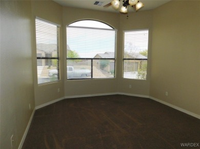 Home is located on a large lot. New interior paint, ceiling fans on Laughlin Ranch Golf Club in Arizona - for sale on GolfHomes.com, golf home, golf lot