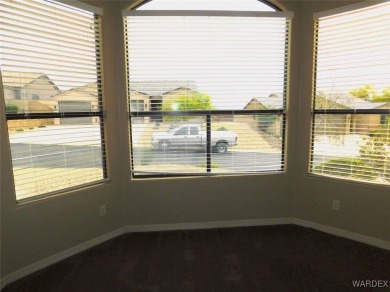 Home is located on a large lot. New interior paint, ceiling fans on Laughlin Ranch Golf Club in Arizona - for sale on GolfHomes.com, golf home, golf lot