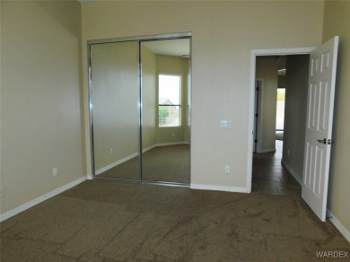 Home is located on a large lot. New interior paint, ceiling fans on Laughlin Ranch Golf Club in Arizona - for sale on GolfHomes.com, golf home, golf lot