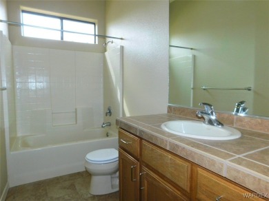 Home is located on a large lot. New interior paint, ceiling fans on Laughlin Ranch Golf Club in Arizona - for sale on GolfHomes.com, golf home, golf lot