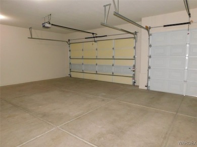 Home is located on a large lot. New interior paint, ceiling fans on Laughlin Ranch Golf Club in Arizona - for sale on GolfHomes.com, golf home, golf lot