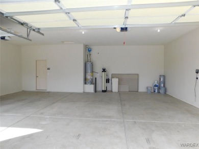 Home is located on a large lot. New interior paint, ceiling fans on Laughlin Ranch Golf Club in Arizona - for sale on GolfHomes.com, golf home, golf lot