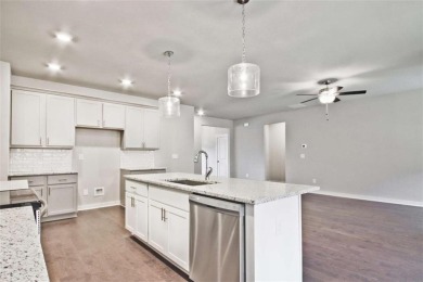 Welcome to 4063 Links Blvd - Built with Heart, Not Just a on Traditions of Braselton Golf Club in Georgia - for sale on GolfHomes.com, golf home, golf lot