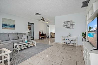 Step into comfort and convenience with this charming and on Leisureville Community Golf Course in Florida - for sale on GolfHomes.com, golf home, golf lot