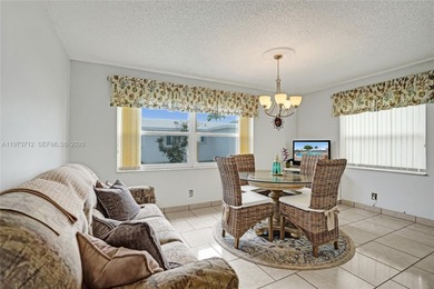 Step into comfort and convenience with this charming and on Leisureville Community Golf Course in Florida - for sale on GolfHomes.com, golf home, golf lot