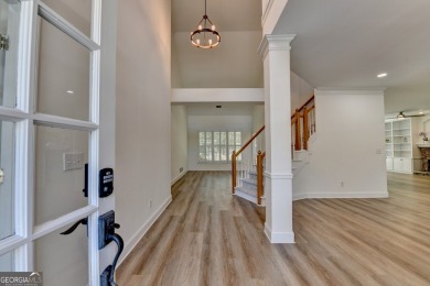 Discover a meticulously designed home that seamlessly blends on Canongate At Olde Atlanta Golf Club in Georgia - for sale on GolfHomes.com, golf home, golf lot