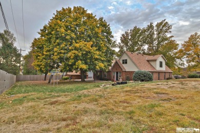 Experience the perfect blend of modern elegance and classic on Syracuse Golf Course in Nebraska - for sale on GolfHomes.com, golf home, golf lot