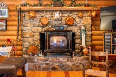 Charming 3-bedroom, 2-bath log home located in the heart of on Woodstone Meadows Golf Course At Massanutten in Virginia - for sale on GolfHomes.com, golf home, golf lot