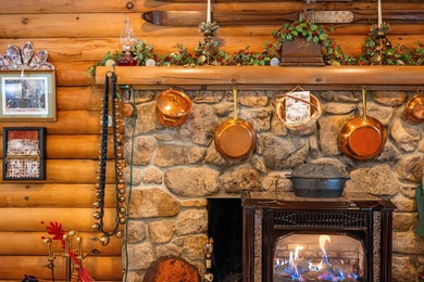 Charming 3-bedroom, 2-bath log home located in the heart of on Woodstone Meadows Golf Course At Massanutten in Virginia - for sale on GolfHomes.com, golf home, golf lot