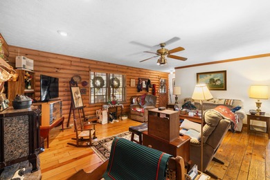 Charming 3-bedroom, 2-bath log home located in the heart of on Woodstone Meadows Golf Course At Massanutten in Virginia - for sale on GolfHomes.com, golf home, golf lot