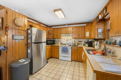 Charming 3-bedroom, 2-bath log home located in the heart of on Woodstone Meadows Golf Course At Massanutten in Virginia - for sale on GolfHomes.com, golf home, golf lot