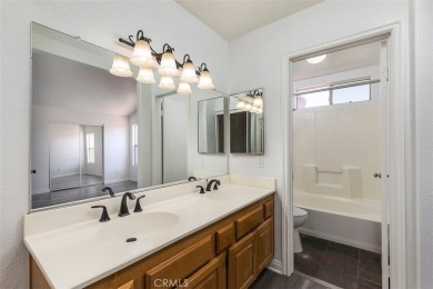 Welcome to this beautifully updated single-family home located on Menifee Lakes Country Club - Lakes in California - for sale on GolfHomes.com, golf home, golf lot