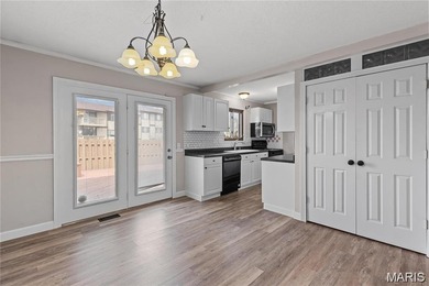 Live the lake life! This nicely updated 3 bedroom, 2.5 bathroom on Lake Saint Louis Par 3 in Missouri - for sale on GolfHomes.com, golf home, golf lot