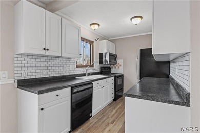 Live the lake life! This nicely updated 3 bedroom, 2.5 bathroom on Lake Saint Louis Par 3 in Missouri - for sale on GolfHomes.com, golf home, golf lot