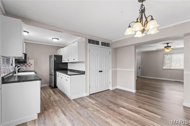 Live the lake life! This nicely updated 3 bedroom, 2.5 bathroom on Lake Saint Louis Par 3 in Missouri - for sale on GolfHomes.com, golf home, golf lot