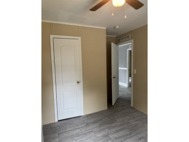 Recently moved to this lot, this beautifully 2015 manufactured on Wildwood Country Club in Florida - for sale on GolfHomes.com, golf home, golf lot