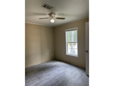 Recently moved to this lot, this beautifully 2015 manufactured on Wildwood Country Club in Florida - for sale on GolfHomes.com, golf home, golf lot