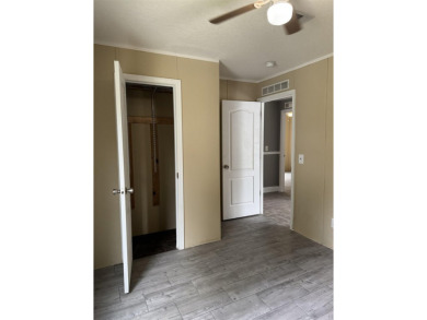 Recently moved to this lot, this beautifully 2015 manufactured on Wildwood Country Club in Florida - for sale on GolfHomes.com, golf home, golf lot