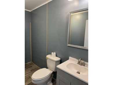 Recently moved to this lot, this beautifully 2015 manufactured on Wildwood Country Club in Florida - for sale on GolfHomes.com, golf home, golf lot