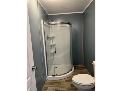 Recently moved to this lot, this beautifully 2015 manufactured on Wildwood Country Club in Florida - for sale on GolfHomes.com, golf home, golf lot