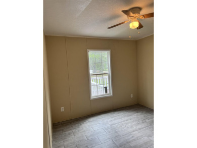 Recently moved to this lot, this beautifully 2015 manufactured on Wildwood Country Club in Florida - for sale on GolfHomes.com, golf home, golf lot