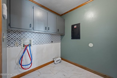 Charming house near 1st Tee of Rock Creek Golf Course. This 2 on Rock Creek Country Club in North Carolina - for sale on GolfHomes.com, golf home, golf lot