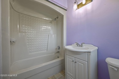 Charming house near 1st Tee of Rock Creek Golf Course. This 2 on Rock Creek Country Club in North Carolina - for sale on GolfHomes.com, golf home, golf lot