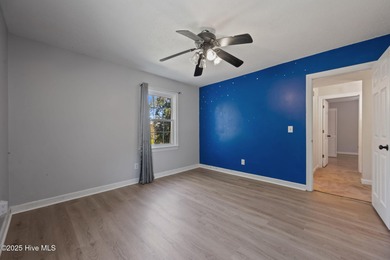 Charming house near 1st Tee of Rock Creek Golf Course. This 2 on Rock Creek Country Club in North Carolina - for sale on GolfHomes.com, golf home, golf lot