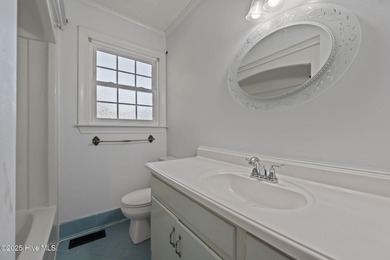 Charming house near 1st Tee of Rock Creek Golf Course. This 2 on Rock Creek Country Club in North Carolina - for sale on GolfHomes.com, golf home, golf lot