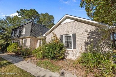 Charming house near 1st Tee of Rock Creek Golf Course. This 2 on Rock Creek Country Club in North Carolina - for sale on GolfHomes.com, golf home, golf lot