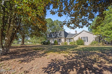 Charming house near 1st Tee of Rock Creek Golf Course. This 2 on Rock Creek Country Club in North Carolina - for sale on GolfHomes.com, golf home, golf lot