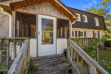 Charming house near 1st Tee of Rock Creek Golf Course. This 2 on Rock Creek Country Club in North Carolina - for sale on GolfHomes.com, golf home, golf lot