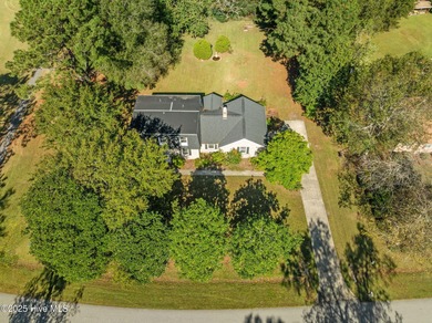 Charming house near 1st Tee of Rock Creek Golf Course. This 2 on Rock Creek Country Club in North Carolina - for sale on GolfHomes.com, golf home, golf lot