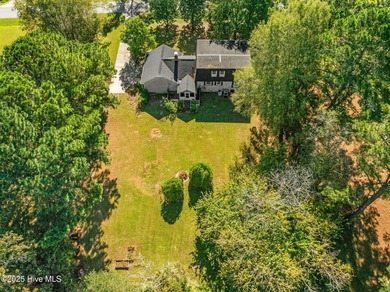 Charming house near 1st Tee of Rock Creek Golf Course. This 2 on Rock Creek Country Club in North Carolina - for sale on GolfHomes.com, golf home, golf lot