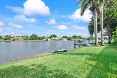 Enjoy breathtaking lakefront views  spectacular sunsets from on Pembroke Lakes Golf Club in Florida - for sale on GolfHomes.com, golf home, golf lot