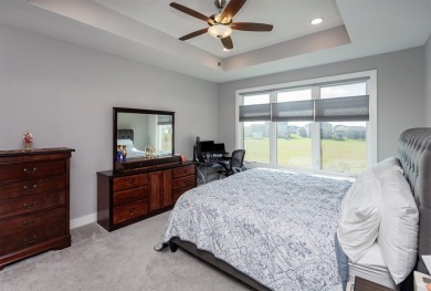 Welcome to a luxurious escape that effortlessly combines on Otter Creek Golf Course in Iowa - for sale on GolfHomes.com, golf home, golf lot