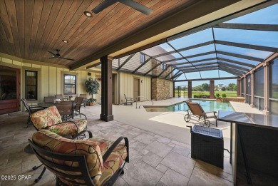 Nestled in a serene setting with views of a pond and golf course on Bay Point Resort Golf Club in Florida - for sale on GolfHomes.com, golf home, golf lot