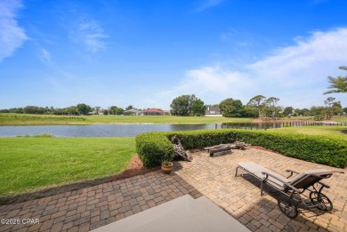 Nestled in a serene setting with views of a pond and golf course on Bay Point Resort Golf Club in Florida - for sale on GolfHomes.com, golf home, golf lot