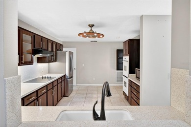 One or more photo(s) has been virtually staged. Tucked into a on Country Club of Mount Dora in Florida - for sale on GolfHomes.com, golf home, golf lot