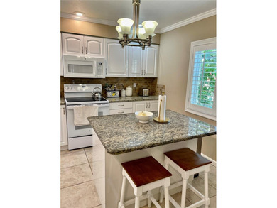 BEAUTIFUL VIZCAYA BOUGAINVILLEA UNIT. This first-floor unit on IMG Academies Golf and Country Club in Florida - for sale on GolfHomes.com, golf home, golf lot