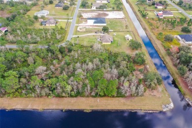 Build your custom dream home on this 1.98 acre lot backed on to on Wedgefield Golf Club in Florida - for sale on GolfHomes.com, golf home, golf lot