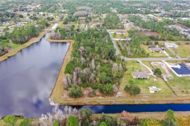 Build your custom dream home on this 1.98 acre lot backed on to on Wedgefield Golf Club in Florida - for sale on GolfHomes.com, golf home, golf lot