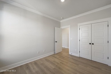 Introducing The Emmy - what a perfect name for a luxury on Brunswick Plantation and Golf Resorts in North Carolina - for sale on GolfHomes.com, golf home, golf lot