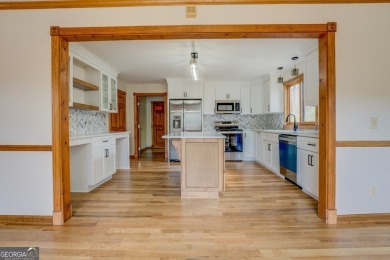 Welcome to this beautifully renovated lakefront home located in on Turtle Cove Golf Course in Georgia - for sale on GolfHomes.com, golf home, golf lot