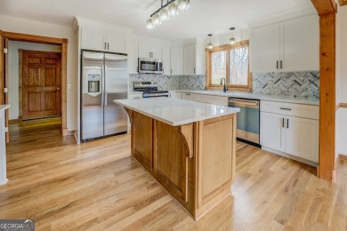 Welcome to this beautifully renovated lakefront home located in on Turtle Cove Golf Course in Georgia - for sale on GolfHomes.com, golf home, golf lot