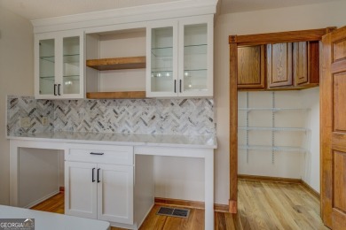 Welcome to this beautifully renovated lakefront home located in on Turtle Cove Golf Course in Georgia - for sale on GolfHomes.com, golf home, golf lot