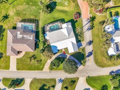 Gorgeous executive one level home on desirable oversized corner on Atlantis Golf Club in Florida - for sale on GolfHomes.com, golf home, golf lot