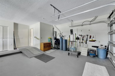 Gorgeous executive one level home on desirable oversized corner on Atlantis Golf Club in Florida - for sale on GolfHomes.com, golf home, golf lot